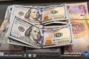 العراق يخفض قيمة ديناره أمام الدولار بنحو 14.5%