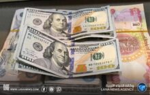 العراق يخفض قيمة ديناره أمام الدولار بنحو 14.5%